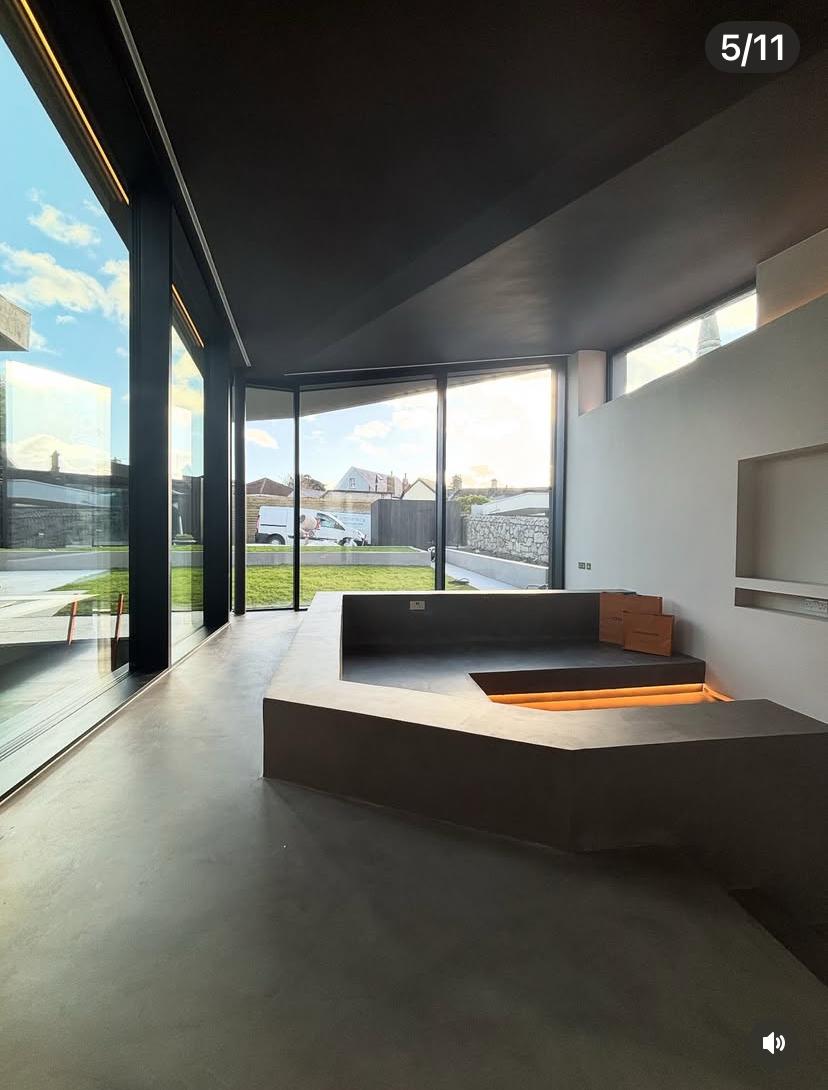 Microcement wall surface with smooth matte finish